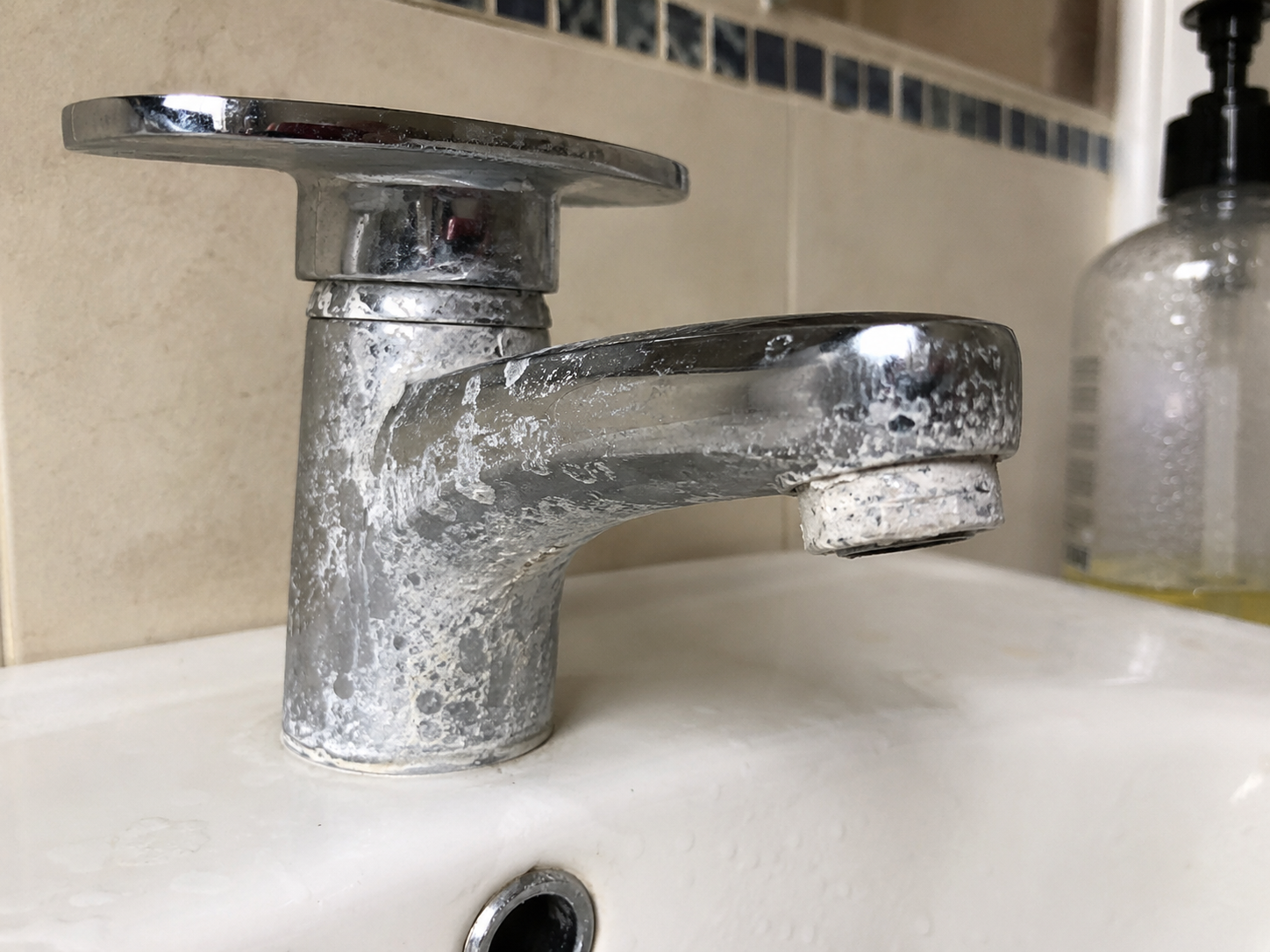 Limescale build-up on a bathroom tap