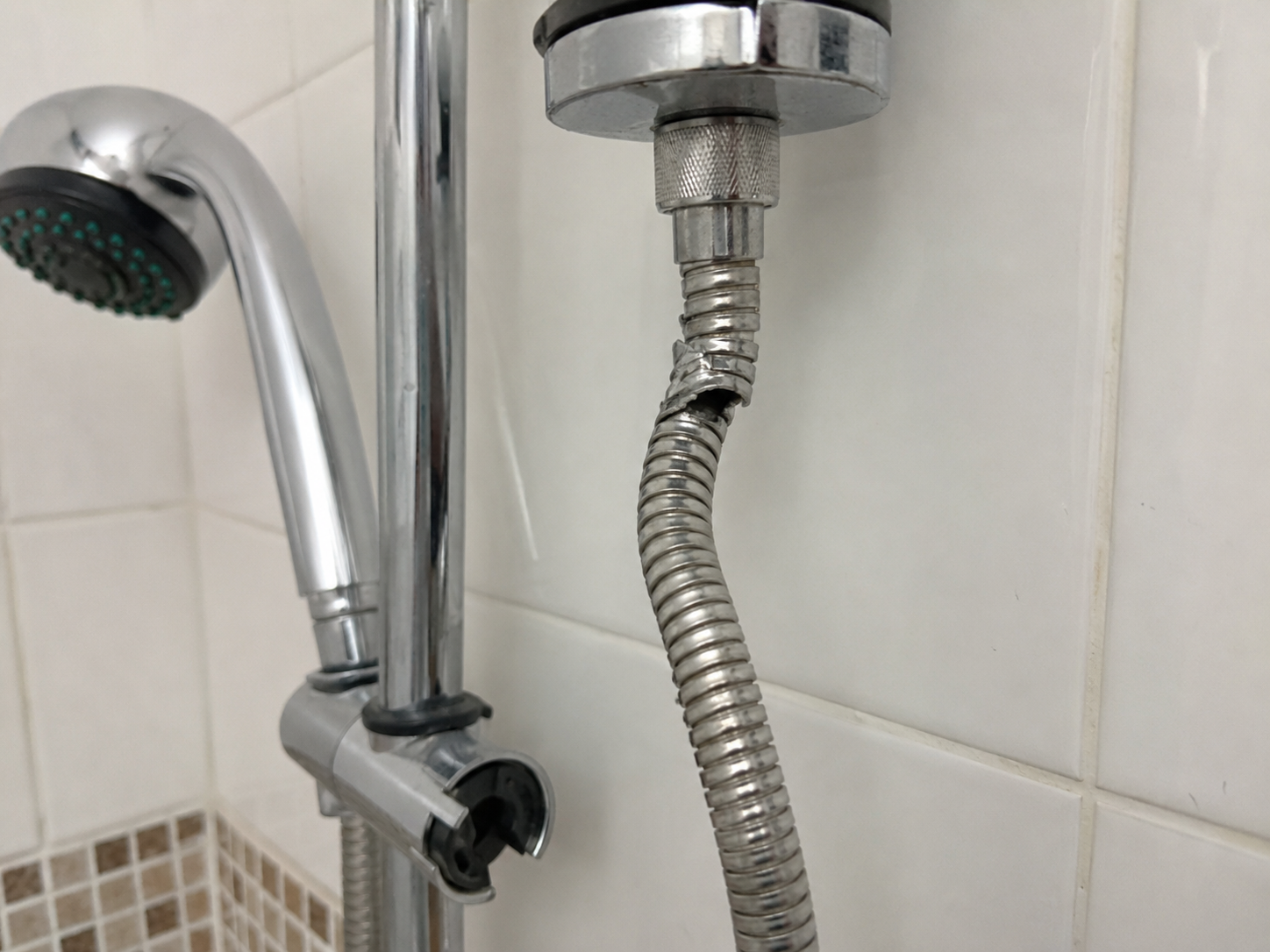 Damaged shower hose restricting water flow